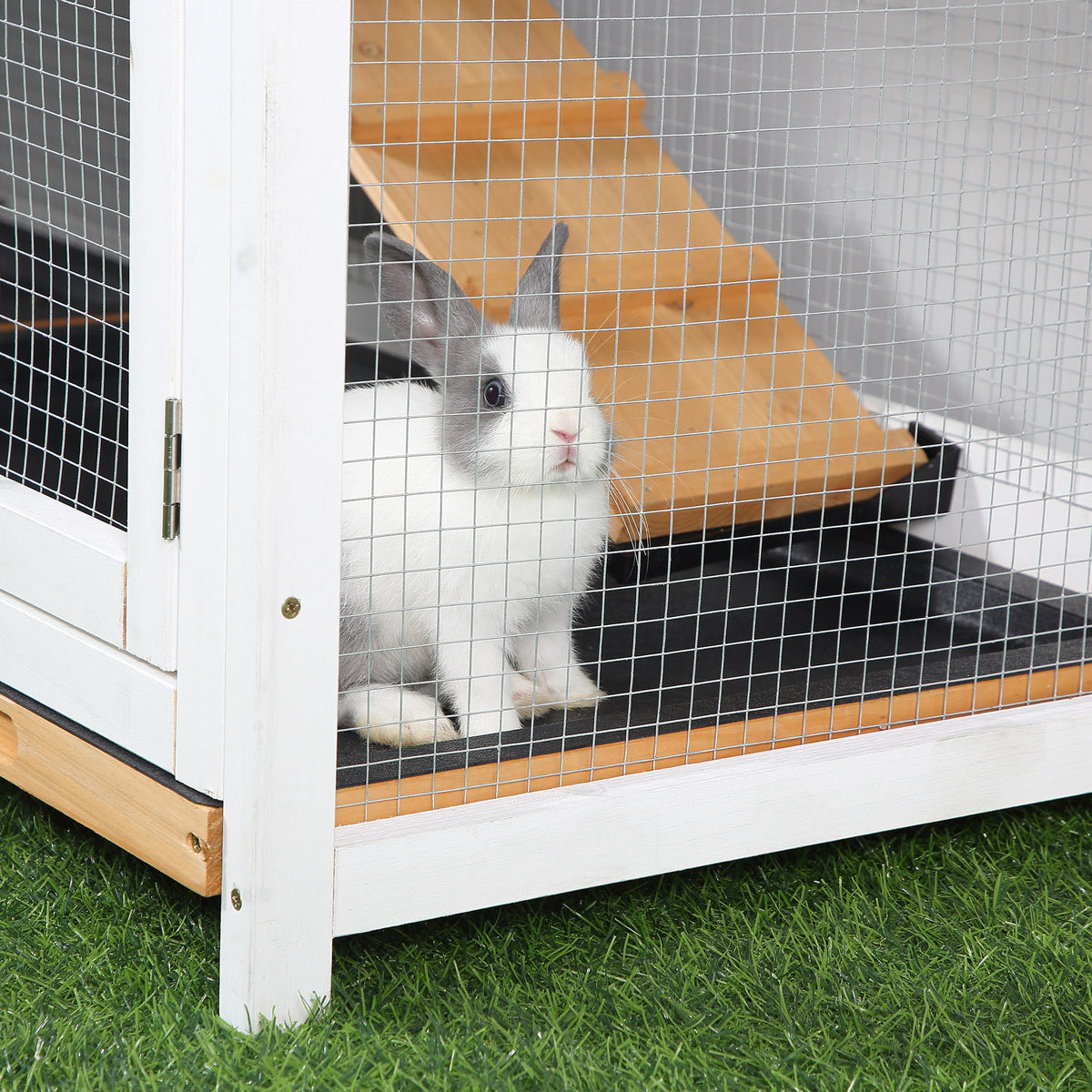 Two-tier wooden rabbit hutch – image 1