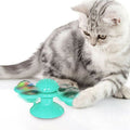 Windmill-style interactive cat toy with suction cup