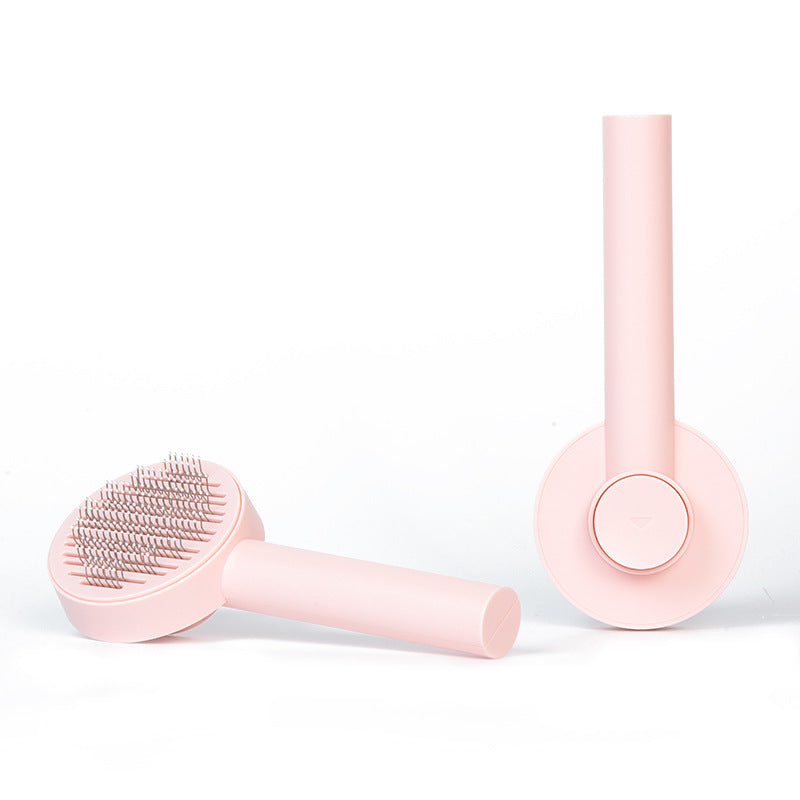 Pink PLUS grooming brush shown from both sides; one brush included