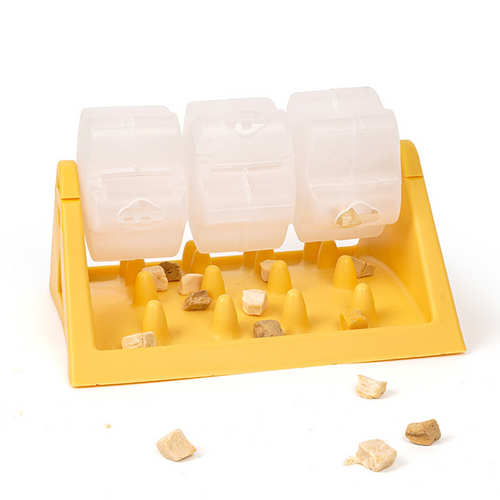 Yellow rotating pet treat feeder with transparent food roller