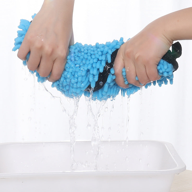Hands wringing the blue pet drying towel