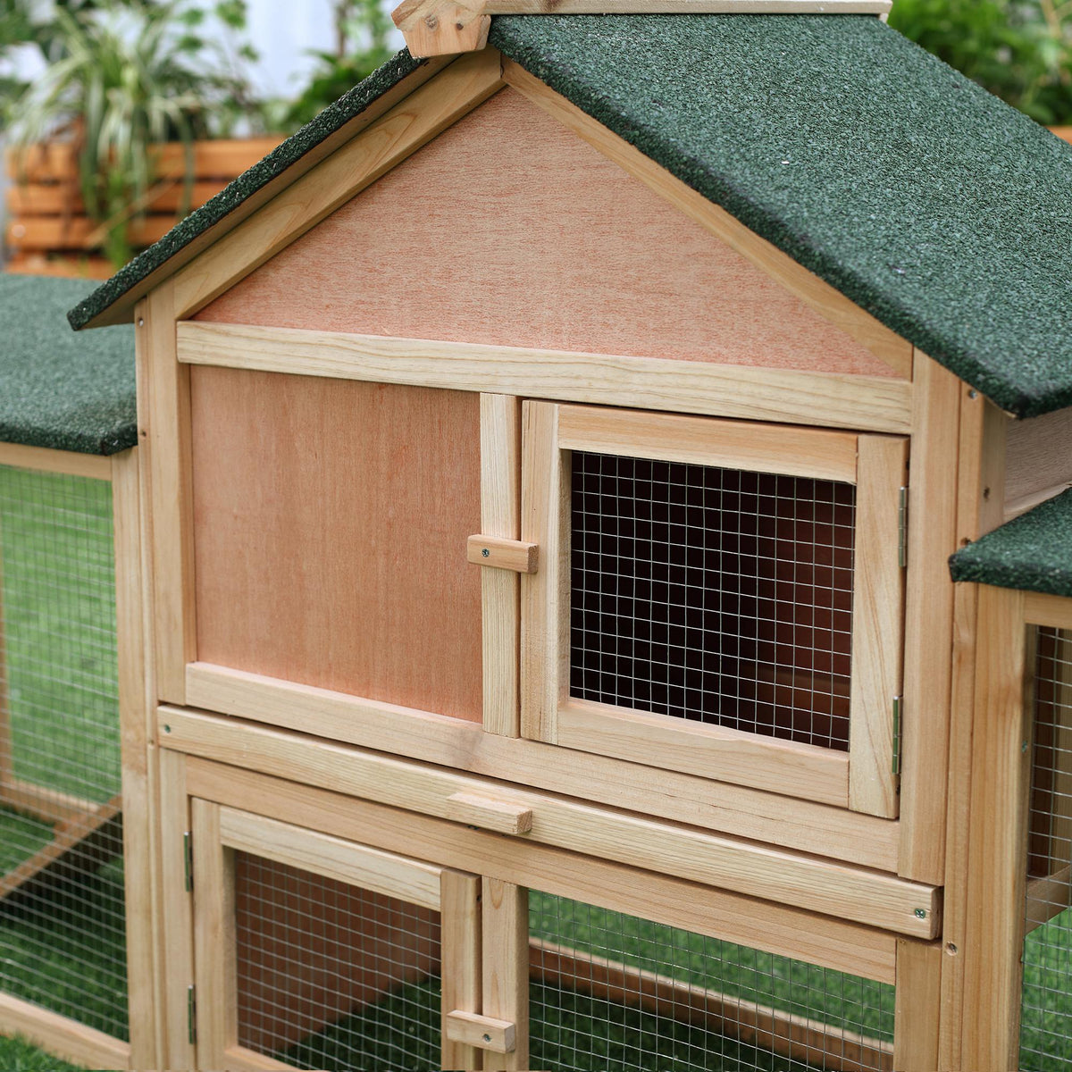 Two-storey wooden rabbit hutch with run – image 1